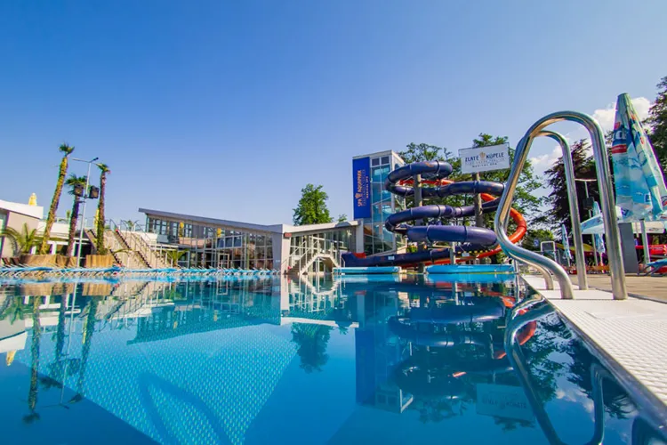 Outdoor swimming pool with slides