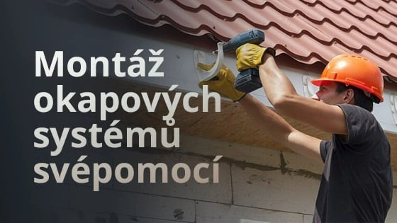 Muž montuje okapový systém pomocí vrtáku na fasádě domu.