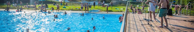 Outdoor swimming pool with people