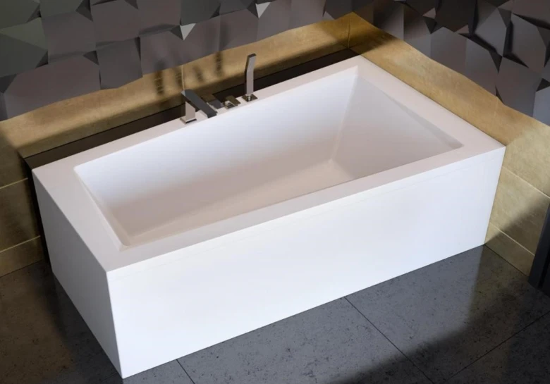 Moderní bílá vana ve stylové koupelně s geometrickými obklady.