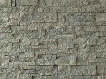 Textura kamenného obkladu pro krb za žhavými kameny.