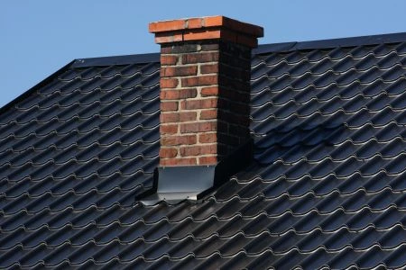 Brick chimney on roof