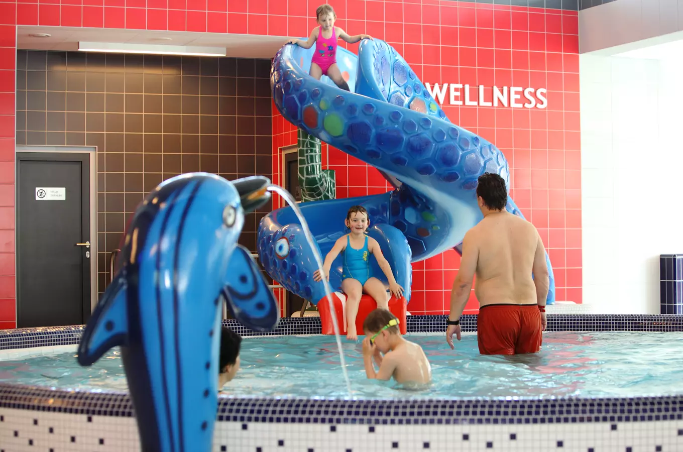 Indoor pool with slide and kids