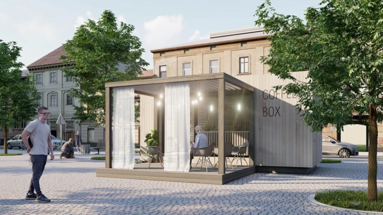 Moderní modulární dřevěný kontejnerový dům s proskleným sedacím místem.