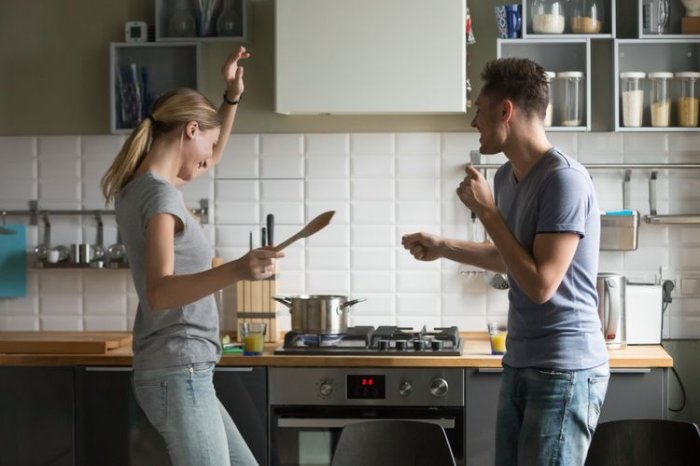 Couple cooking in kitchen