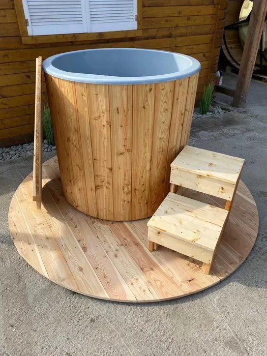 Wooden outdoor bathtub with steps