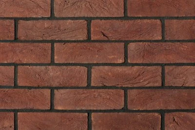 Červené cihlový obklad za krb žáruvzdorný materiál