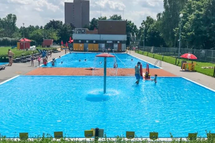 Outdoor swimming pool with people